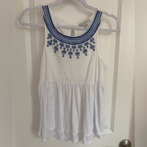 White American Eagle tank w/ blue embroidery detail and flared fit. Size M.